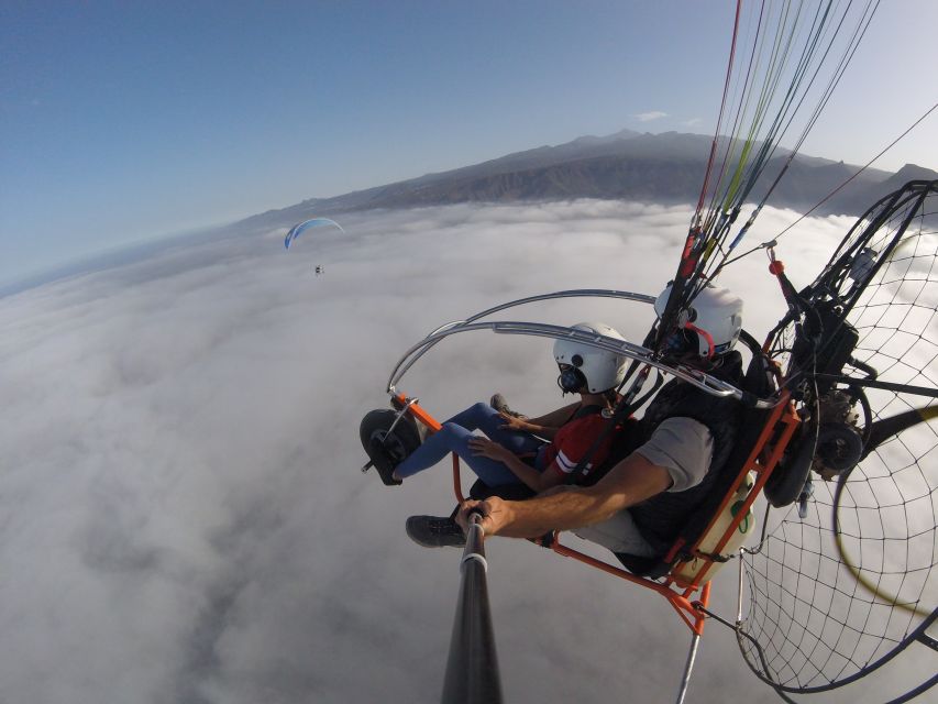 Adeje: Paratrike Flying Tour with Hotel Pickup and Photos - Puerto Colón and the return across Adeje
