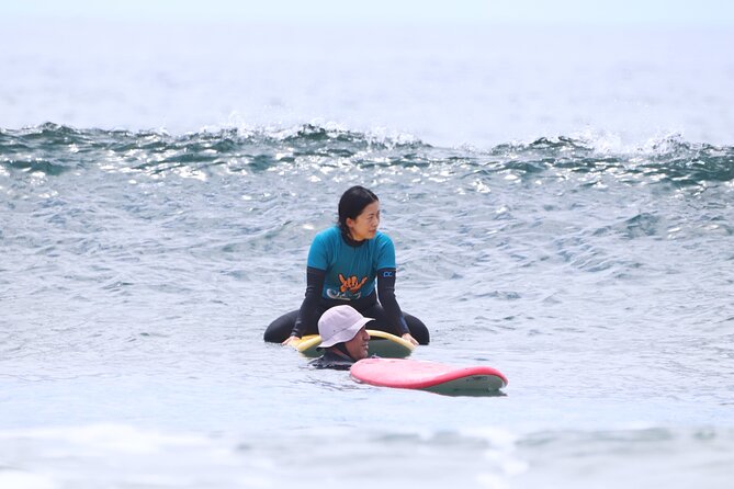 Group Surf Class in Playa de Las Américas with Photographs - Entering the water with an instructor nearby