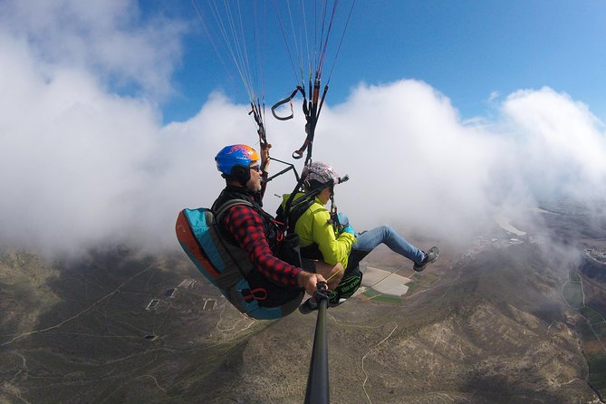 Premium Paragliding in Tenerife : Photos, videos and pickup included - Teide, cliffs, and the Atlantic from above
