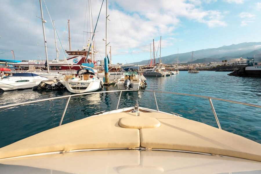 Puerto Colón: Coastal Boat Cruise with Swimming and Snacks - Leaving Puerto Colón on the Bellamar