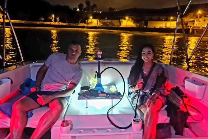 Romantic night ocean boat trip for 2 - Coastline lights on the way to La Caleta