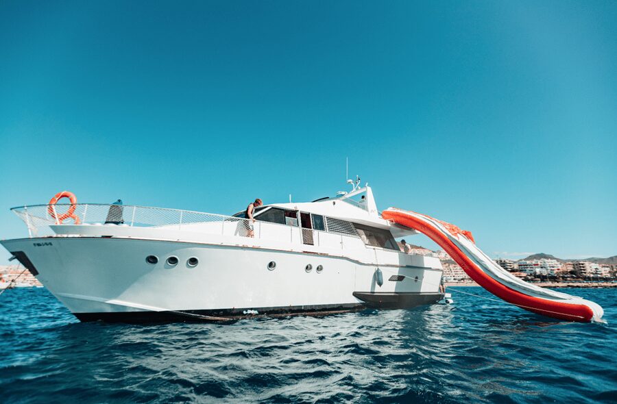 Tenerife: Fun Yacht Trip with Water Activities and Toys - Coastal views toward Palm Mar