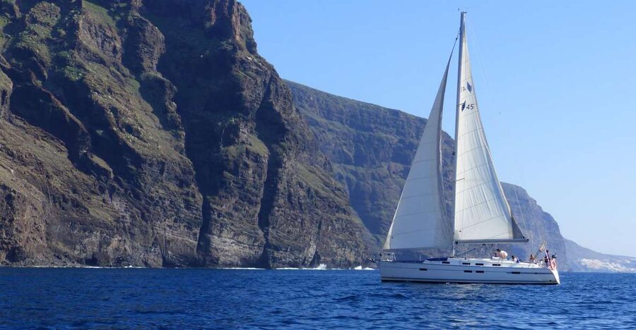 A sailing boat under the cliffs of Los Gigantes, Tenerife