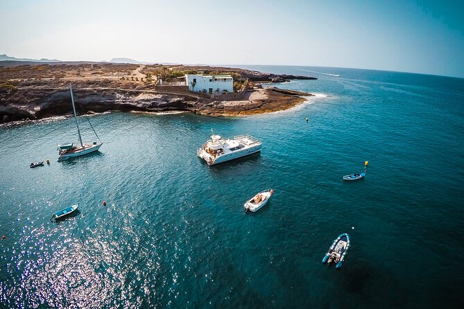 Tenerife Sunset Catamaran tour with transfer - Food and Drinks included. - Leaving Puerto Colón for the open water